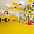 黃色兒童培訓機構藝術周型收納墻體柜大型墻體休息區(qū)大廳設計
