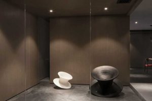 中央空調裝修棕色調旋轉藝術沙發(fā)員工休息區(qū)裝修圖工作室設計