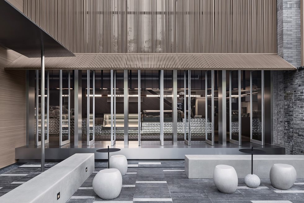 現(xiàn)代風飲品店不銹鋼玻璃門裝修設計